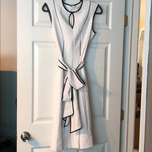 Eva Mendes white dress with black trim and sash